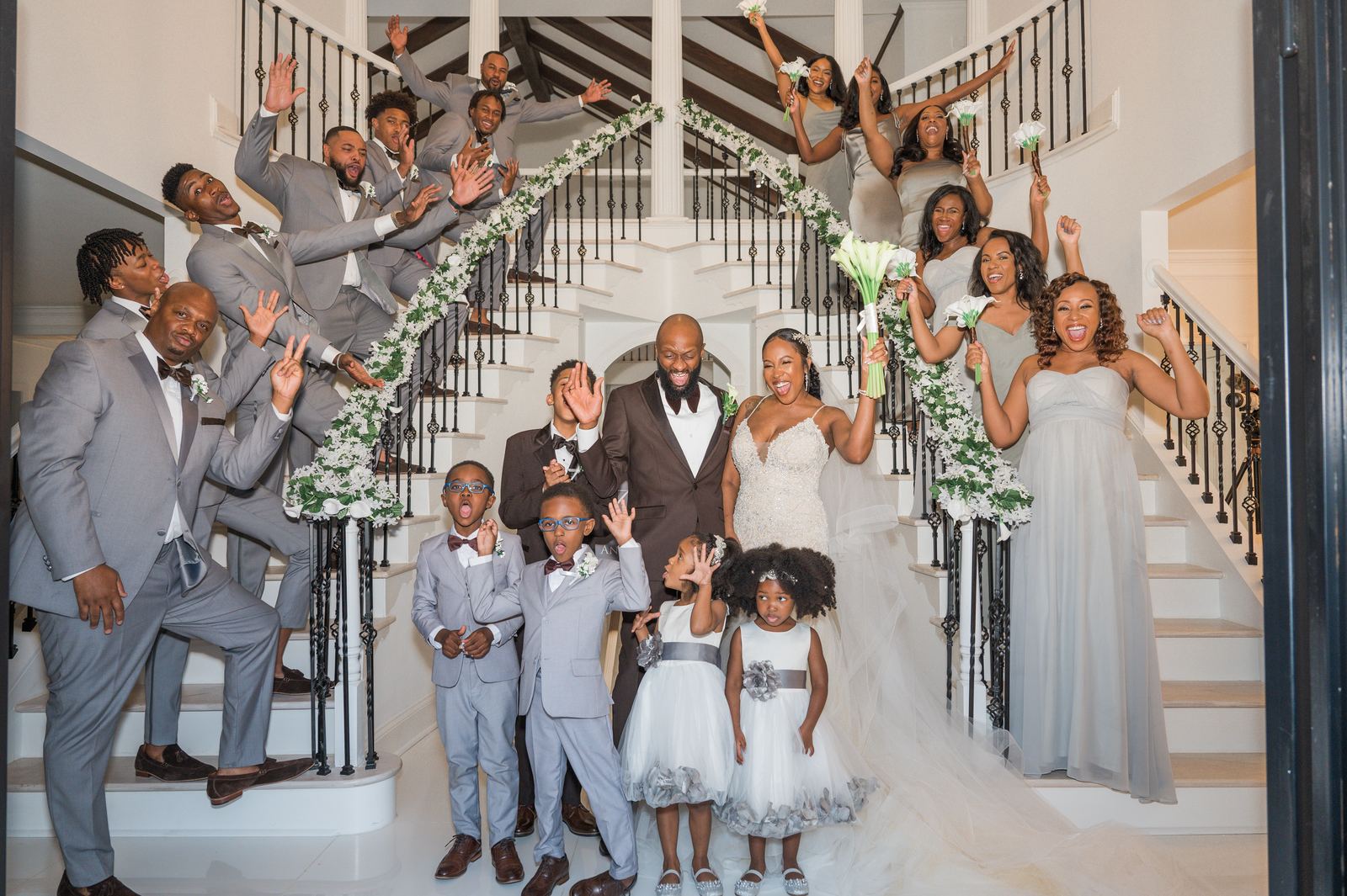 Full wedding party on the staircase