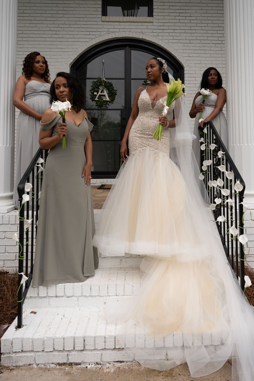 Anjanette with her bridesmaids on the steps