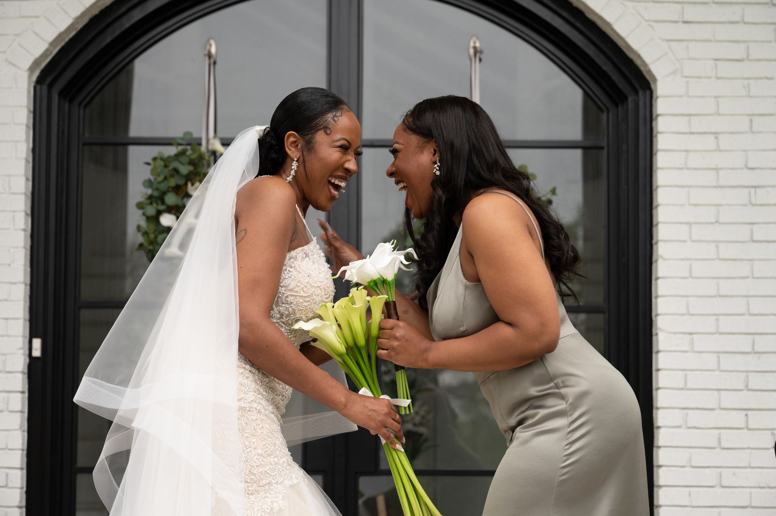 Anjanette laughing with a bridesmaid