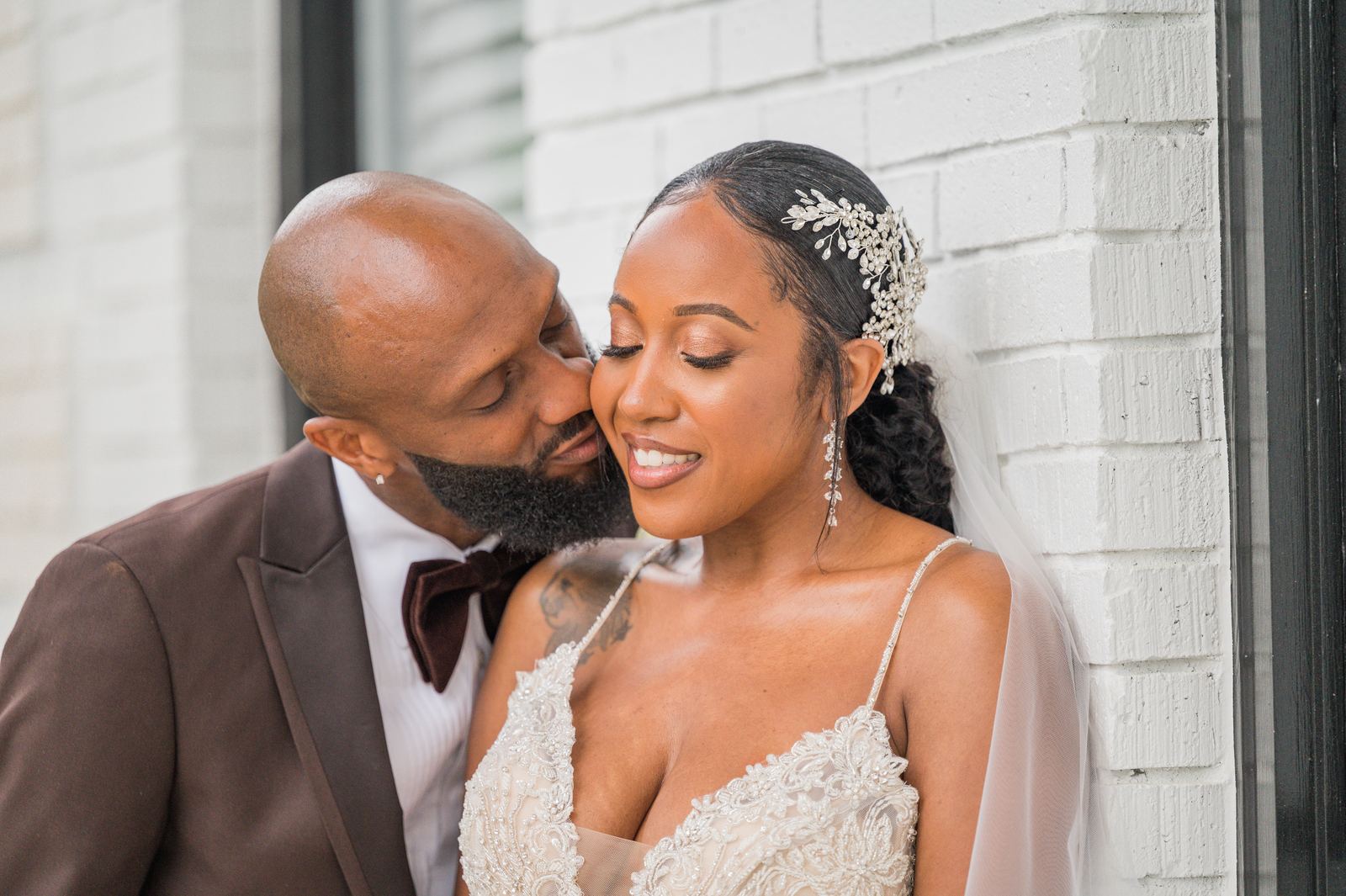 Ritchie kissing Anjanette on the cheek