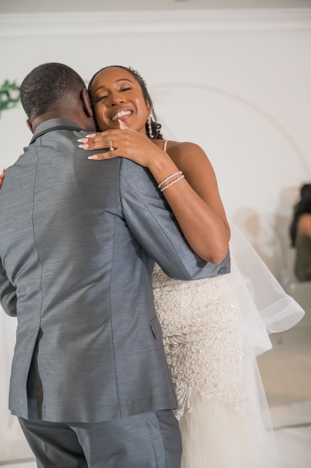 Anjanette hugging a guest