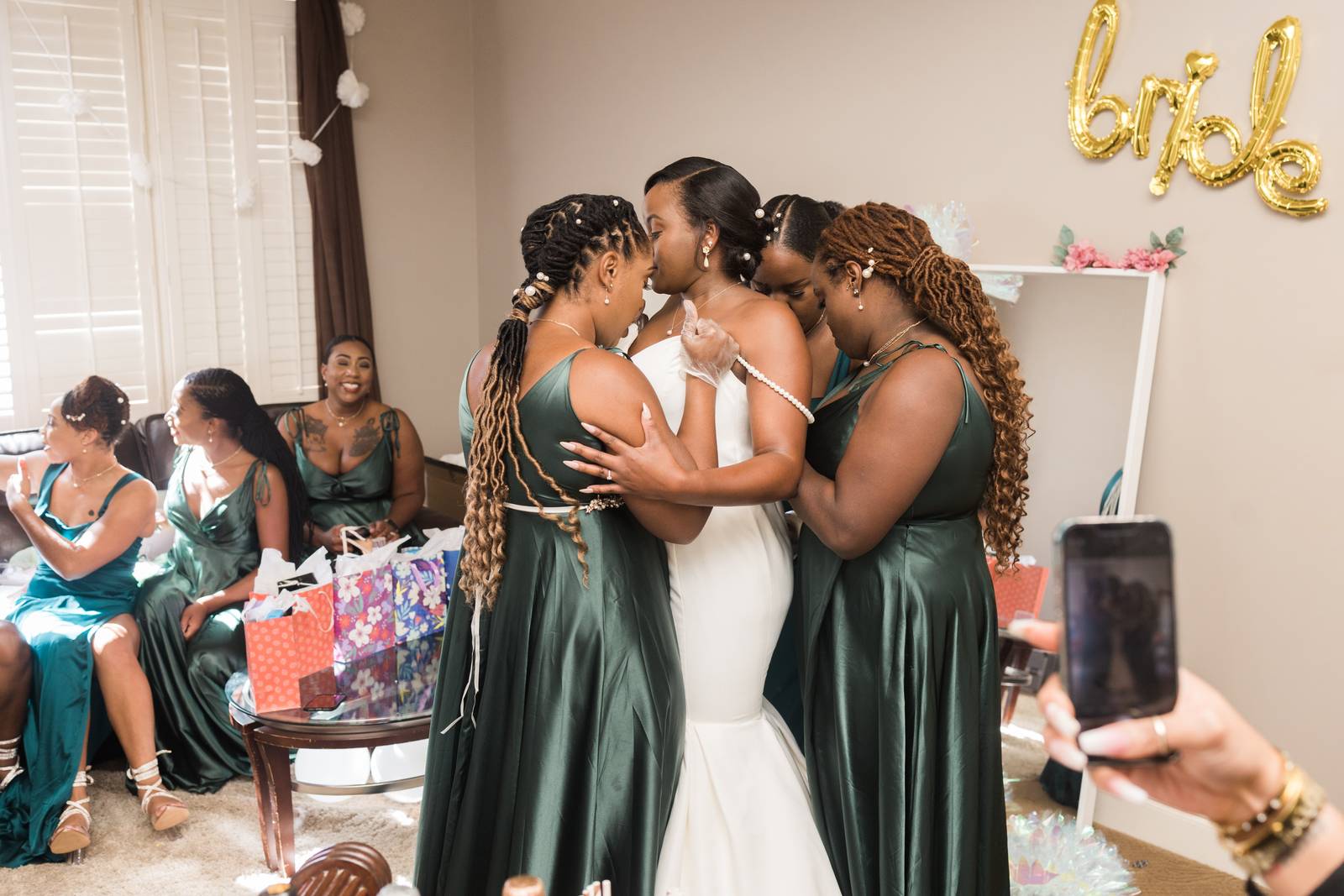 Christina hugging her bridesmaids