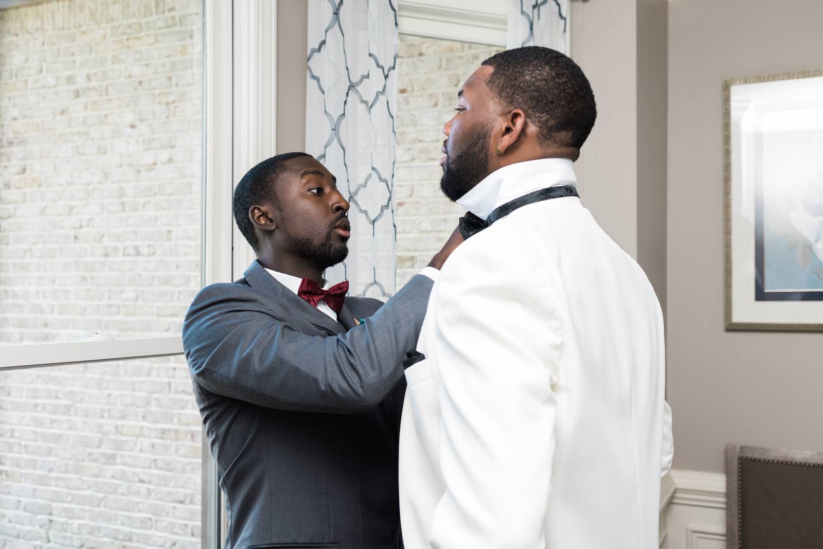 Darius getting his bow tie fixed
