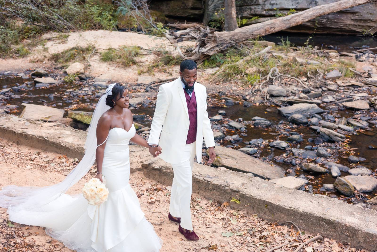 Christina and Darius walking hand in hand