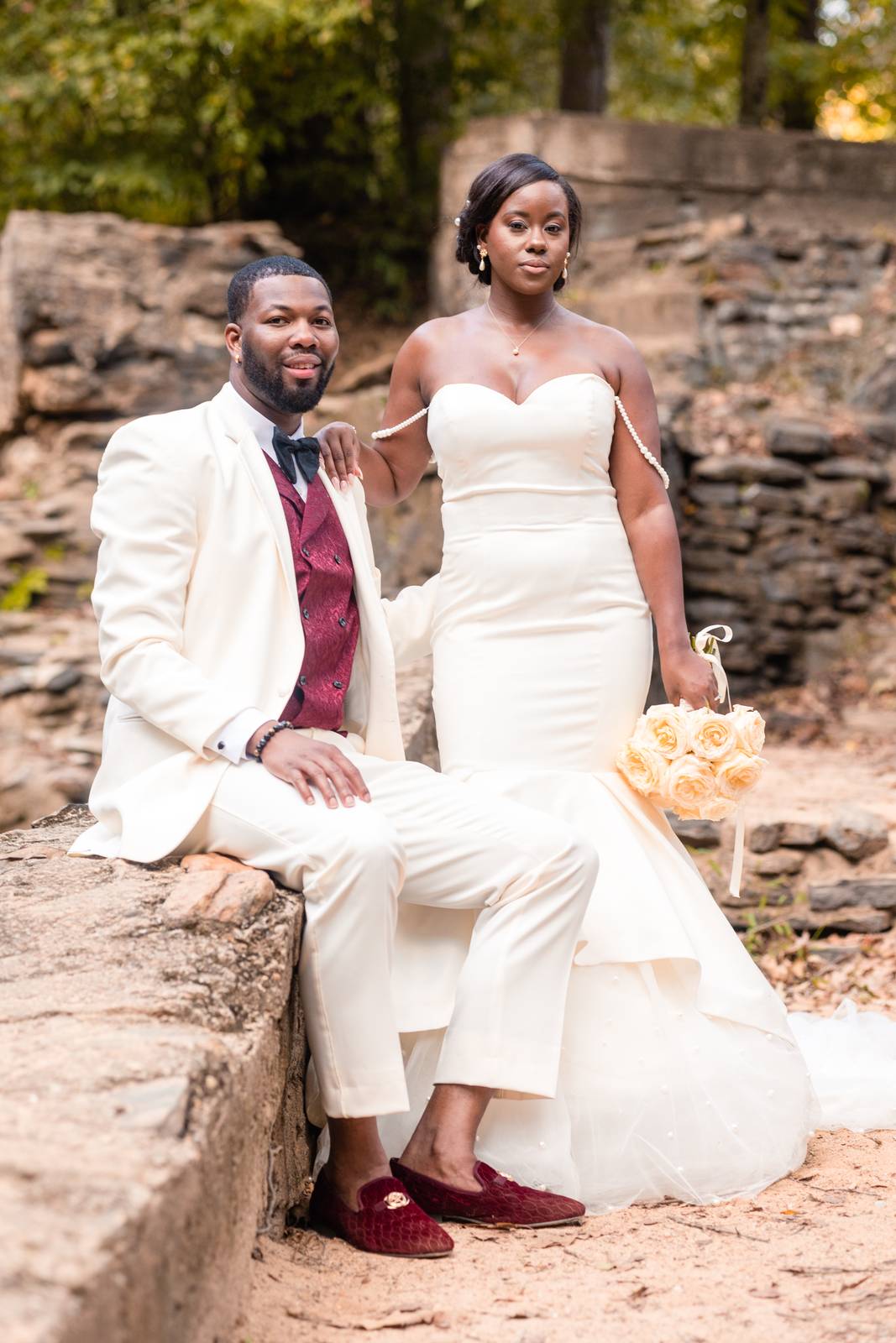 Christina and Darius seated on the wall