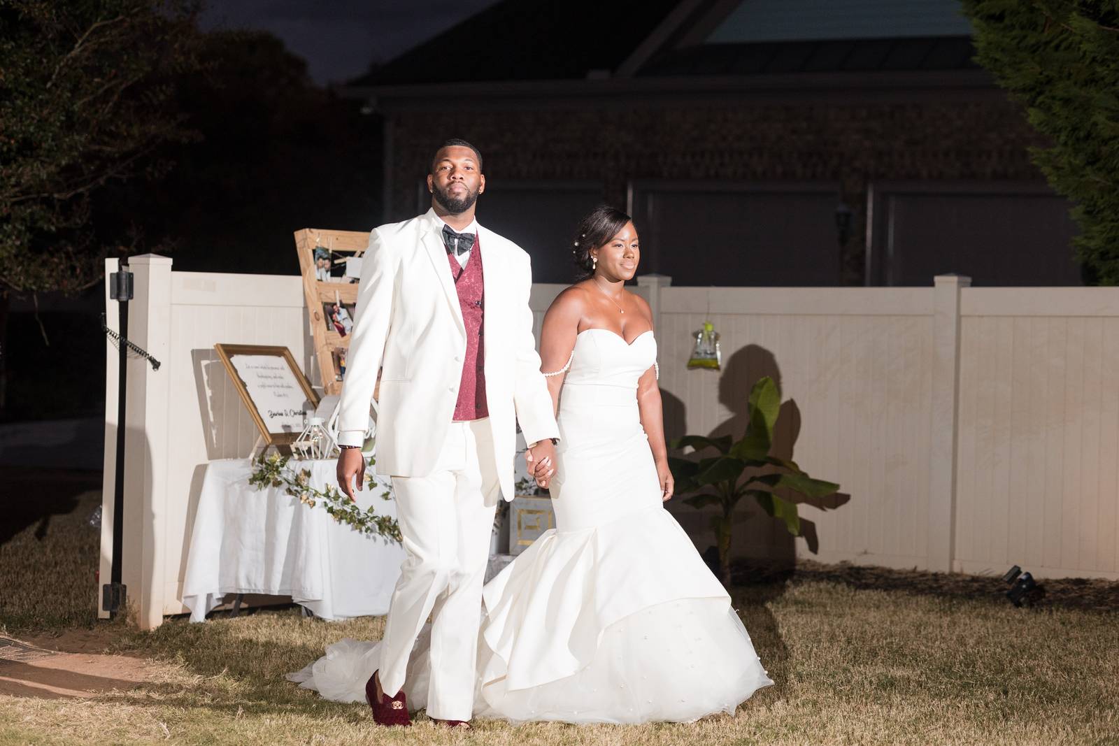 Christina and Darius walking into the reception