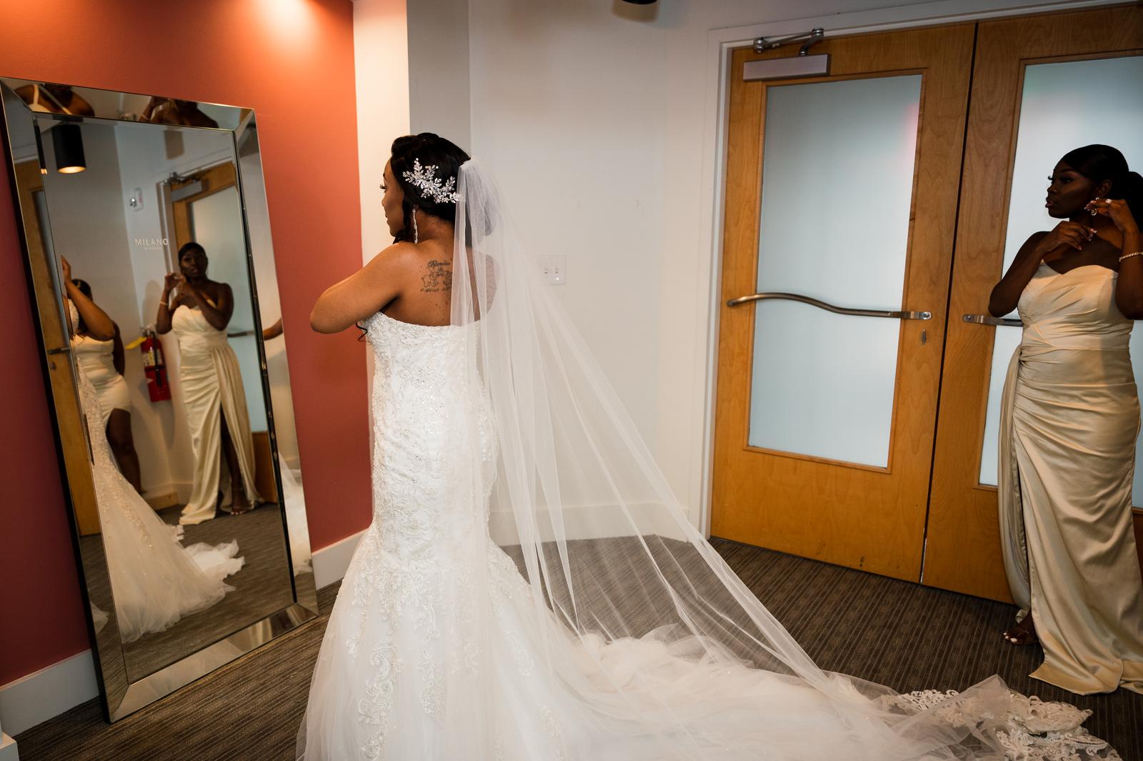 Haley in the mirror with her veil