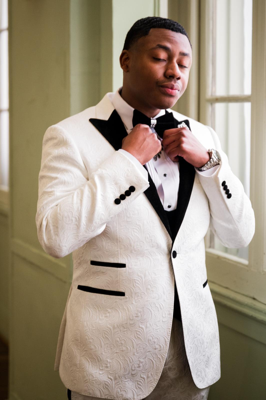 Kordel fixing his bow tie
