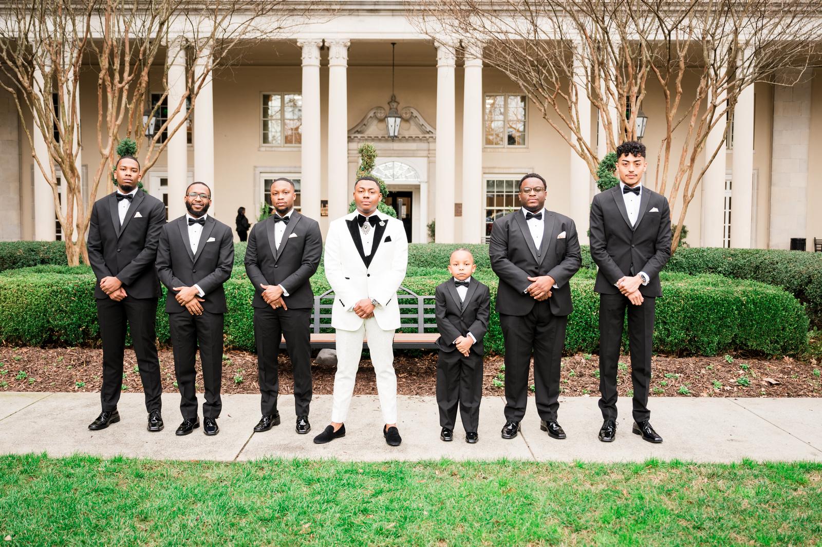 Kordel with his groomsmen on the lawn
