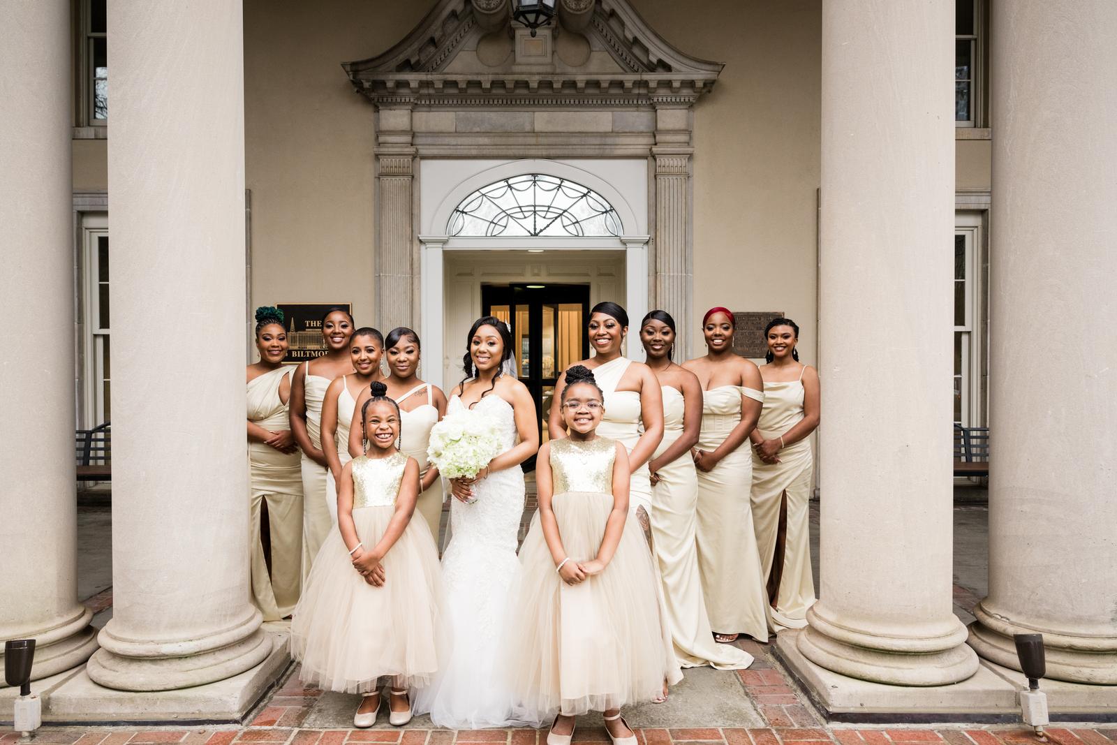 Full wedding party at the columns