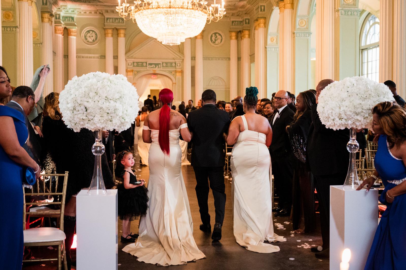 Haley and Kordel walking back up the aisle