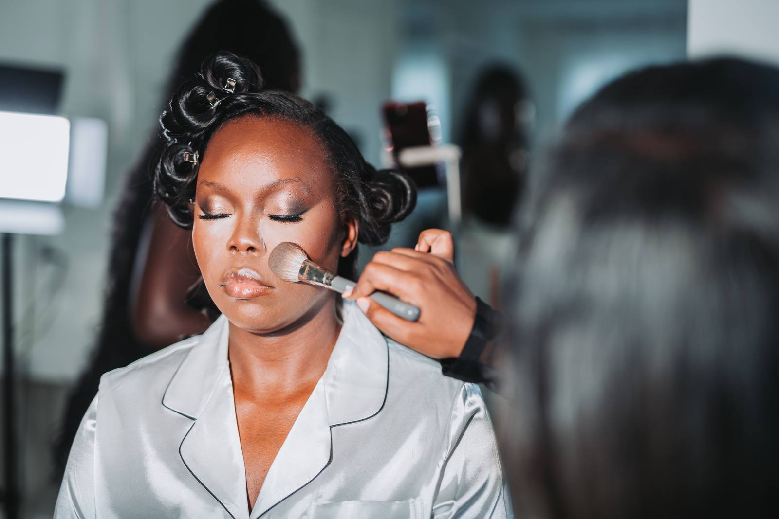 Latisha getting makeup done