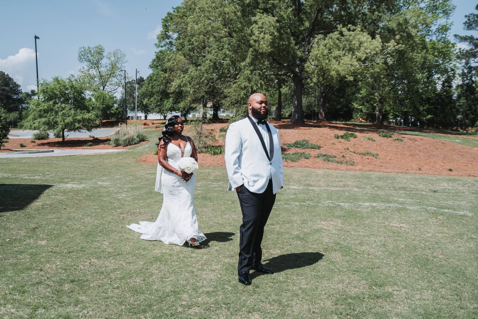 Latisha and Nate walking across the lawn