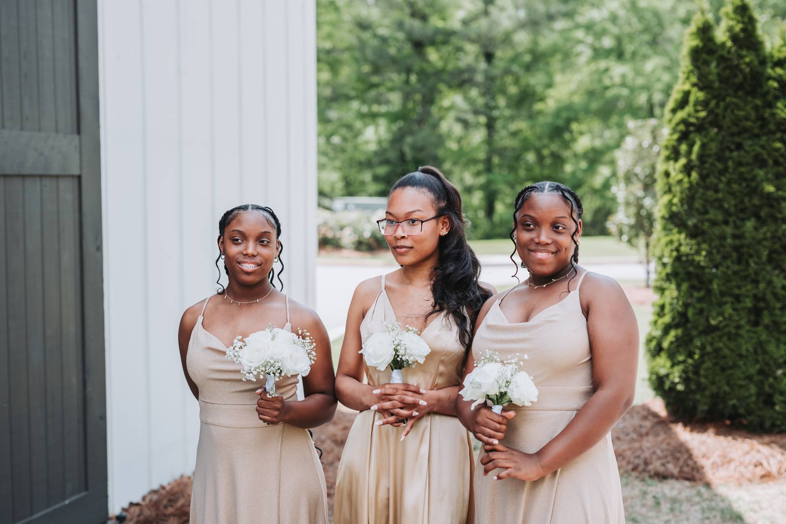 Bridesmaids in champagne gowns