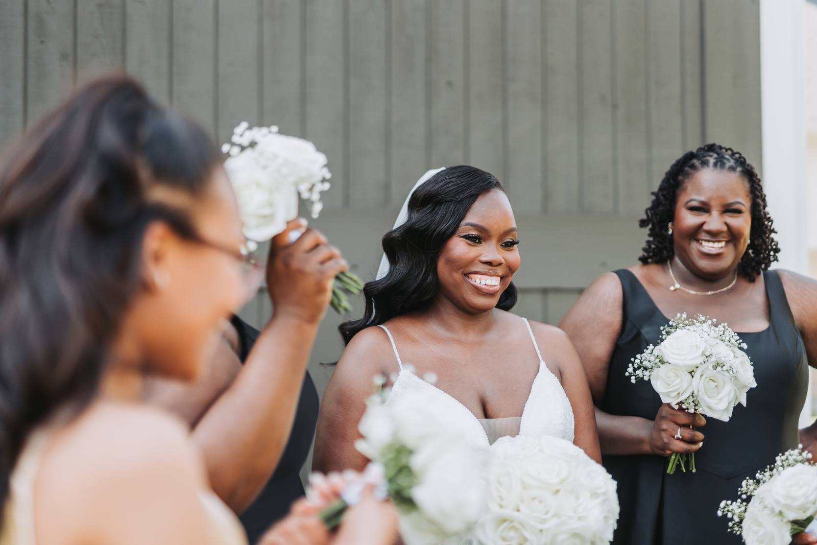 Latisha laughing with her bridesmaids