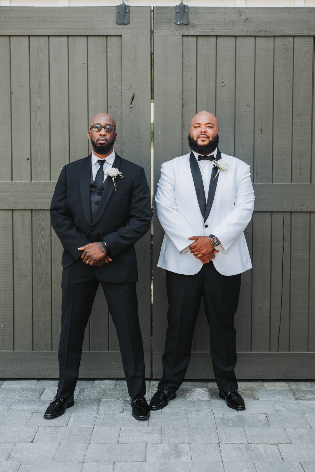 Nate and his best man at the barn doors