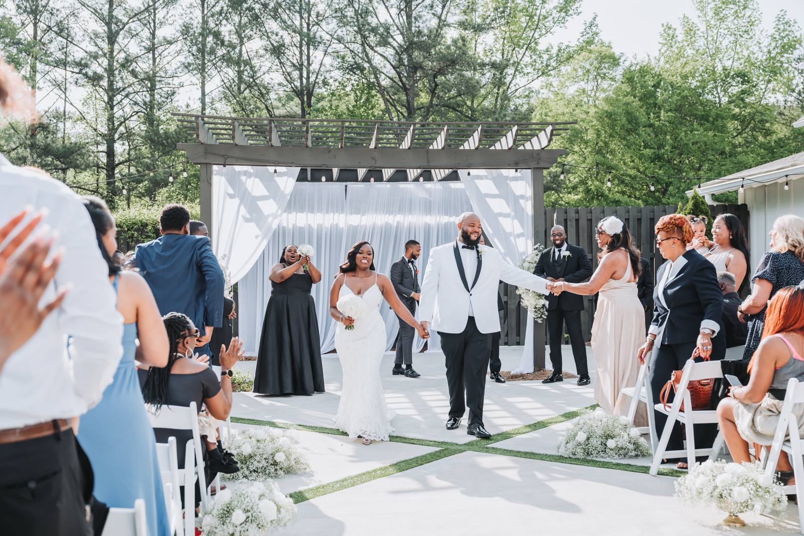 Latisha and Nate walking back up the aisle