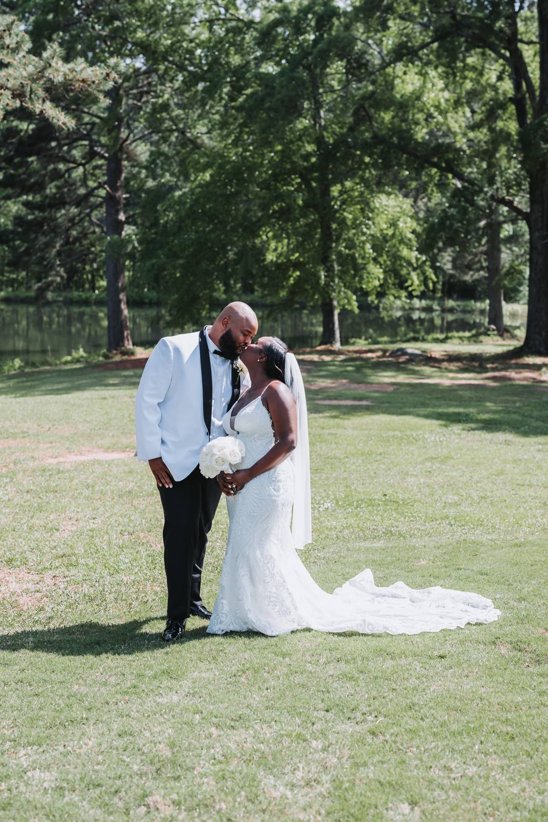Latisha and Nate kissing in the field