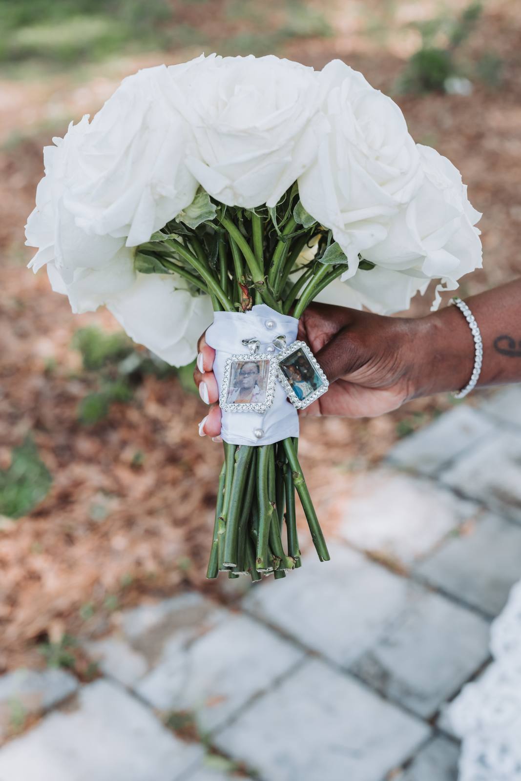 Latisha's bouquet with a memorial charm