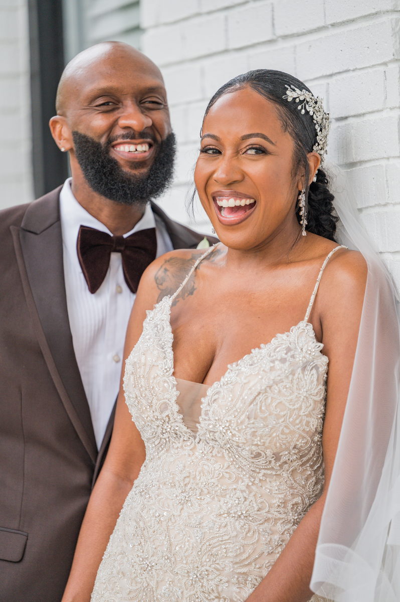 Anjanette and Ritchie laughing straight to camera