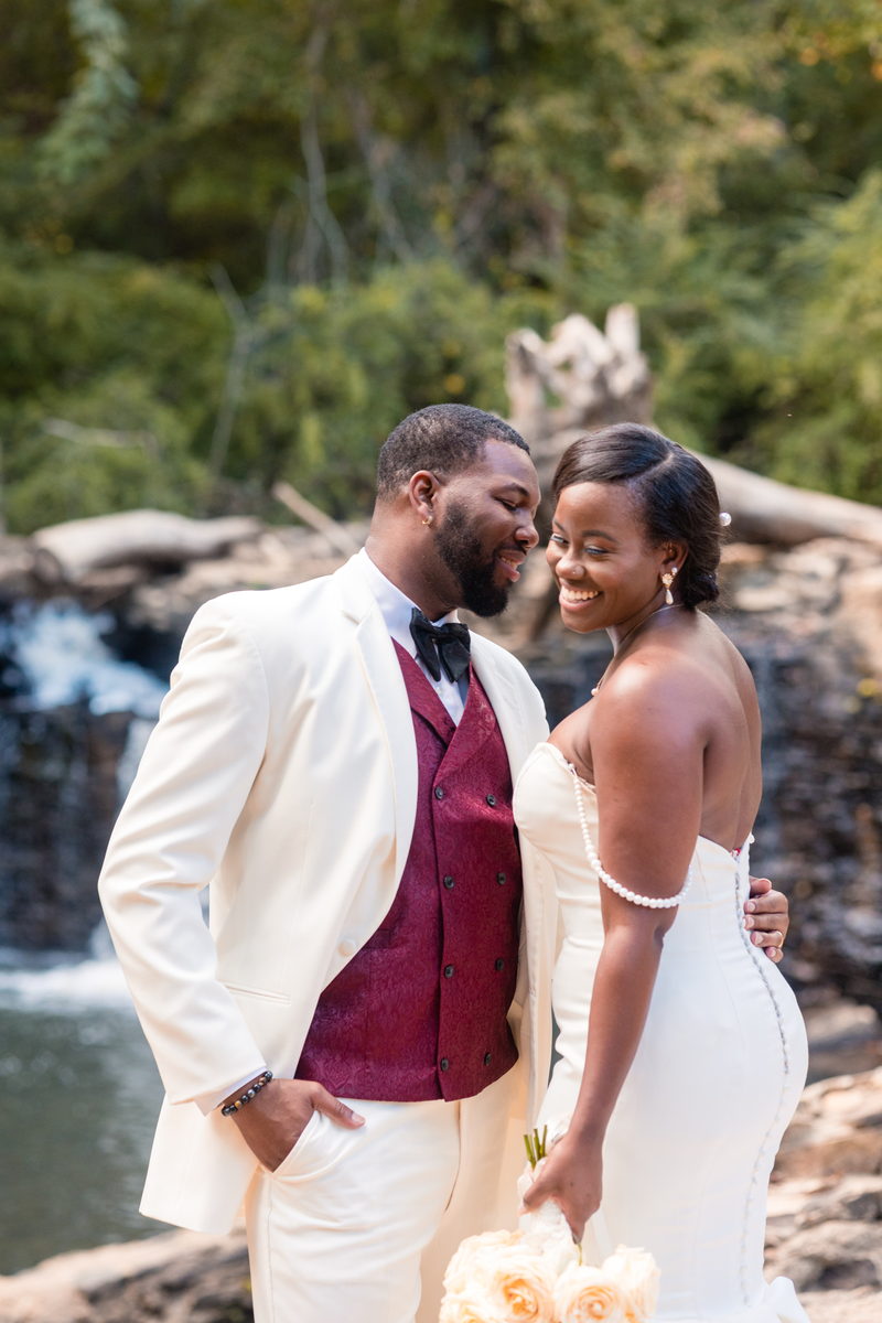 Christina and Darius forehead to forehead before the waterfall