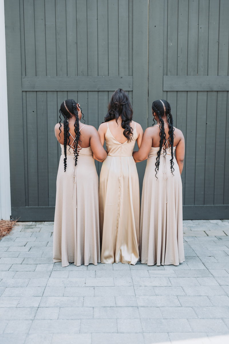 Bridesmaids from behind in champagne satin