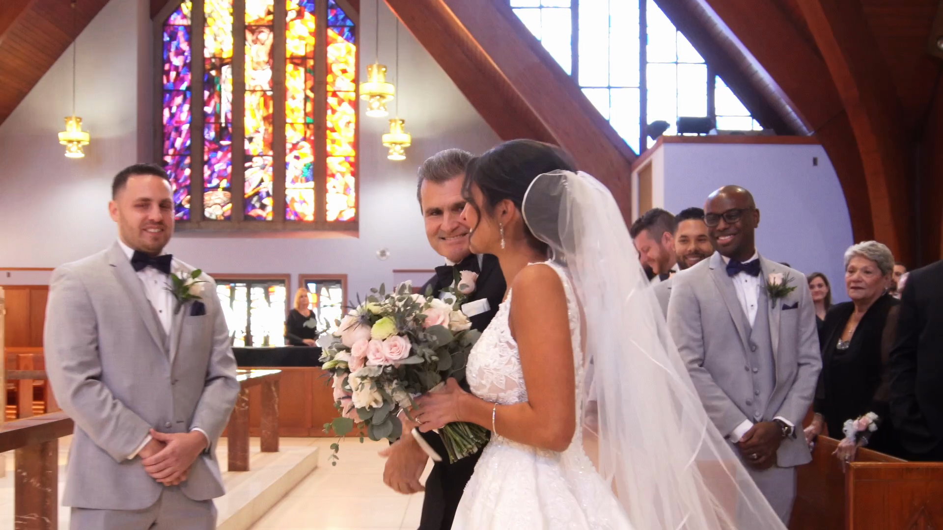Alyssa arriving at the altar, Will waiting beneath stained glass
