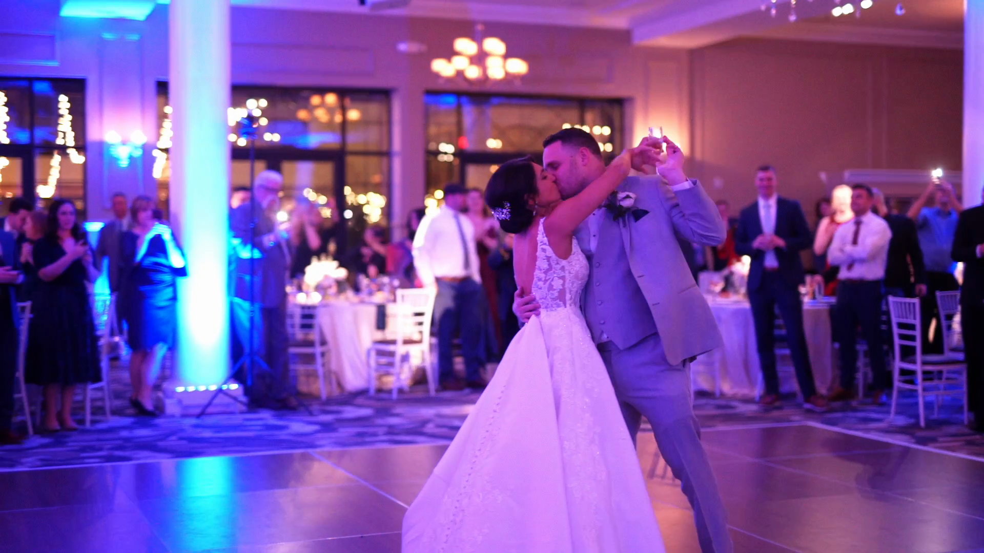 Alyssa and Will's first dance in blue uplight